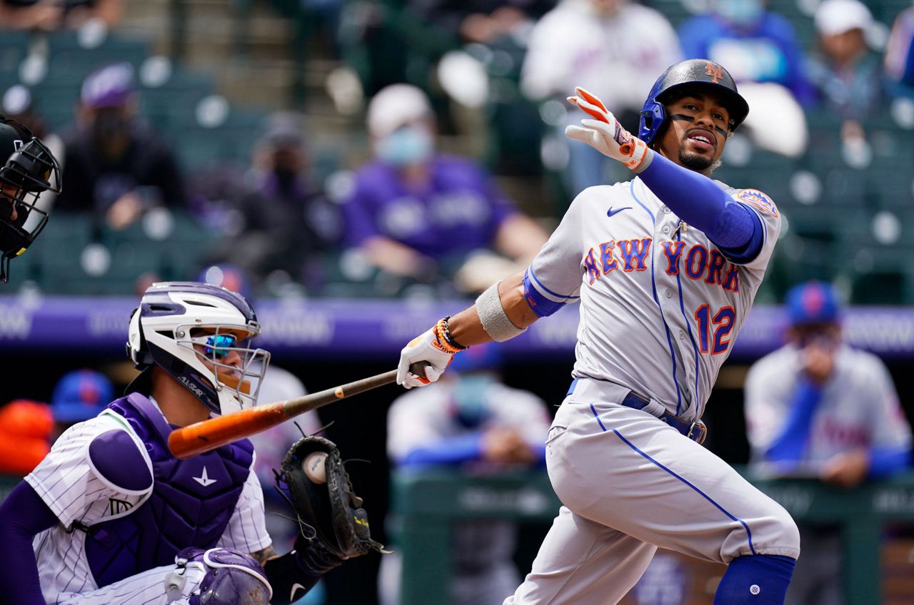 Francisco Lindor of the New York Mets reacts after striking out to