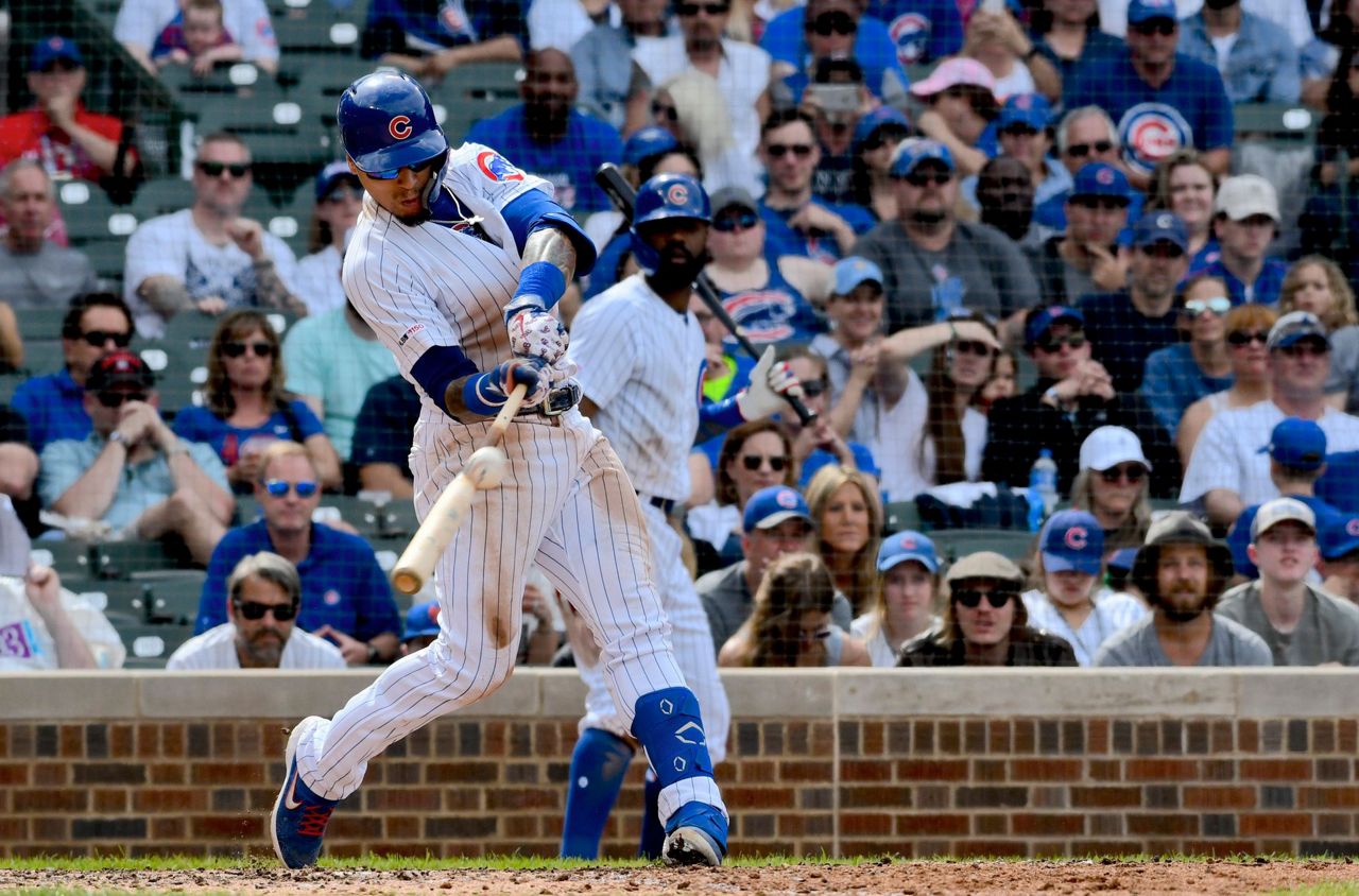 Javier Baez connects for a solo home run in Game 7