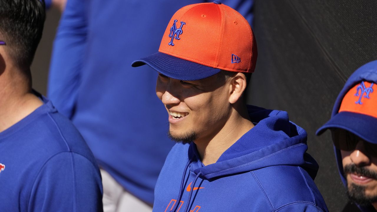 New York Mets pitcher Kodai Senga smiles during a spring training baseball workout Tuesday, Feb. 20, 2024, in Port St. Lucie, Fla. (AP Photo/Jeff Roberson)