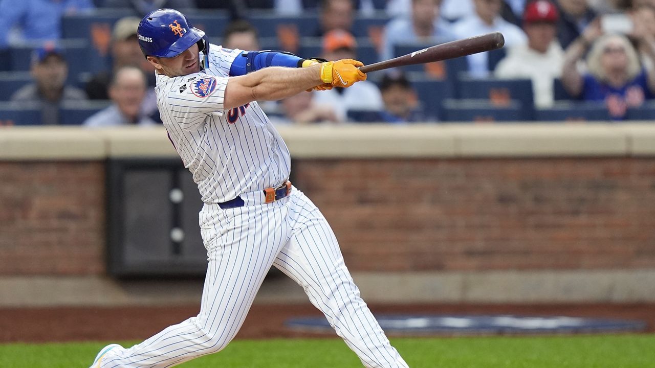 New York Mets Pete Alonso (20) connects for a solo home run against the Philadelphia Phillies during the second inning of Game 3 of the National League baseball playoff series on Tuesday, Oct. 8, 2024 in New York. (AP Photo/Frank Franklin II)