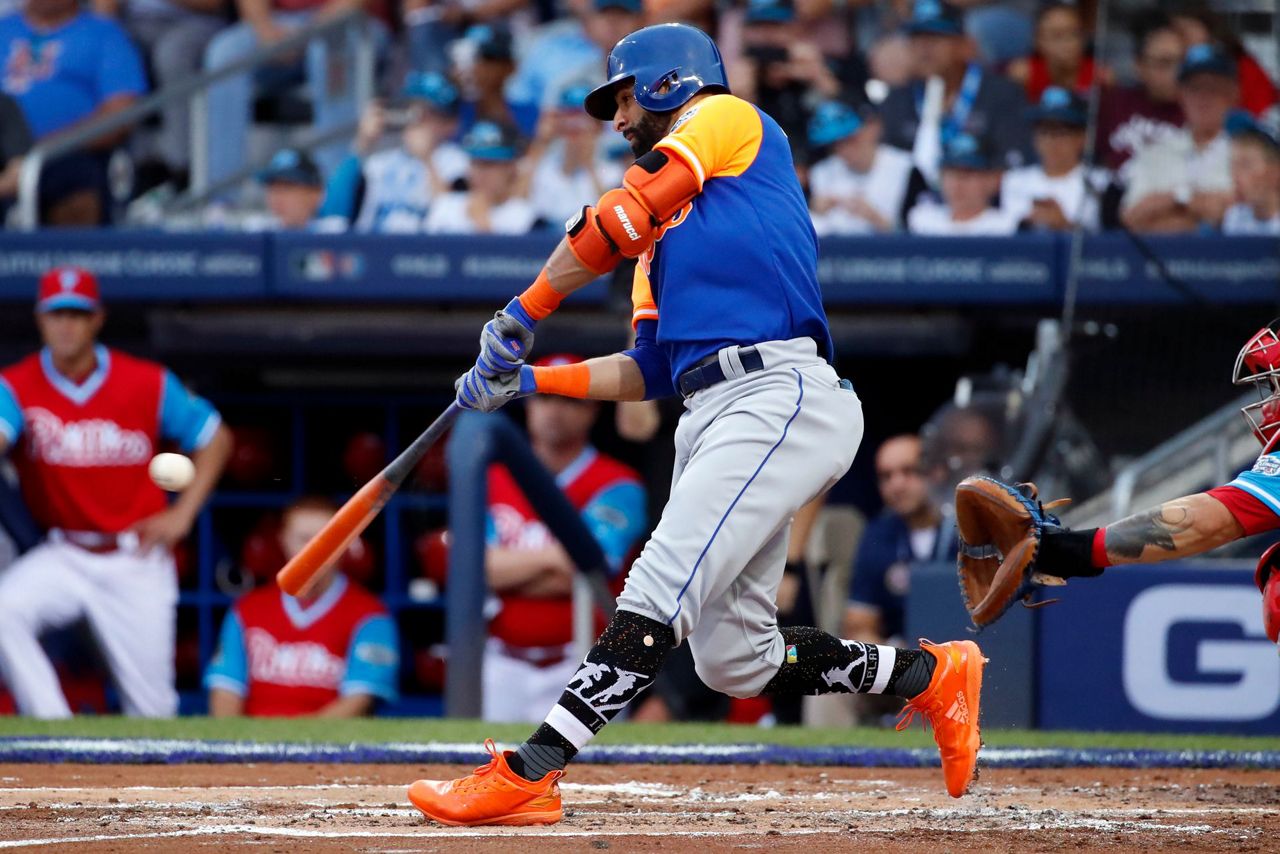 Philadelphia Phillies Scott Kingery bats against the New York Mets during  the Little League Classic baseball game at Bowman Field in Williamsport,  Pa., Sunday, Aug. 19, 2018. (AP Photo/Tom E. Puskar Stock