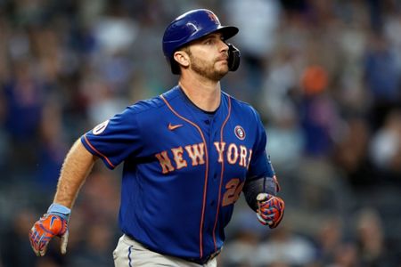 New York Mets' Dominic Smith gestures as he runs the bases after a  game-tying home run in the ninth inning of the team's baseball game against  the Atlanta Braves on Thursday, July