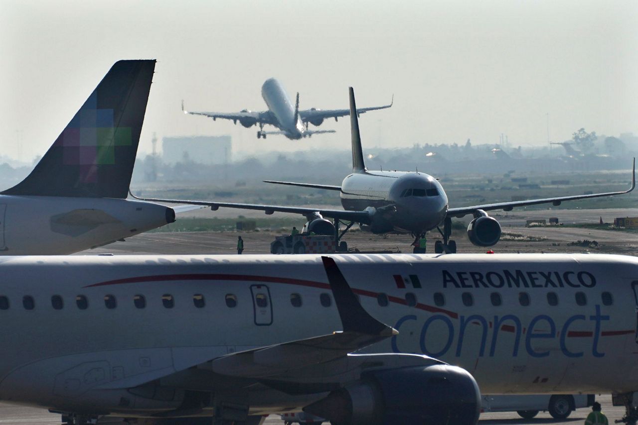 Other passengers support man who opened emergency exit and walked on ...