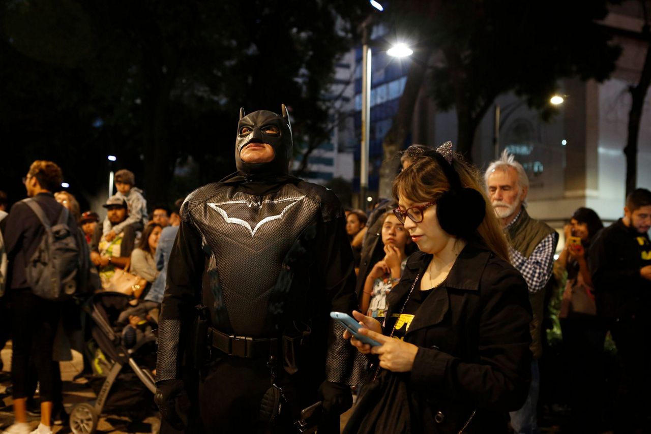 Holy anniversary! Displays of bat signal fete Batman at 80