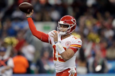 Kansas City Chiefs defensive back Daniel Sorensen, right, intercepts a pass  intended for Los Angeles Chargers running back Austin Ekeler, left, during  the second half of an NFL football game Monday, Nov.