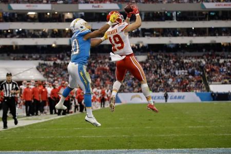 Kansas City Chiefs defensive back Daniel Sorensen, right, intercepts a pass  intended for Los Angeles Chargers running back Austin Ekeler, left, during  the second half of an NFL football game Monday, Nov.