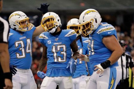 Kansas City Chiefs defensive back Daniel Sorensen, right, intercepts a pass  intended for Los Angeles Chargers running back Austin Ekeler, left, during  the second half of an NFL football game Monday, Nov.