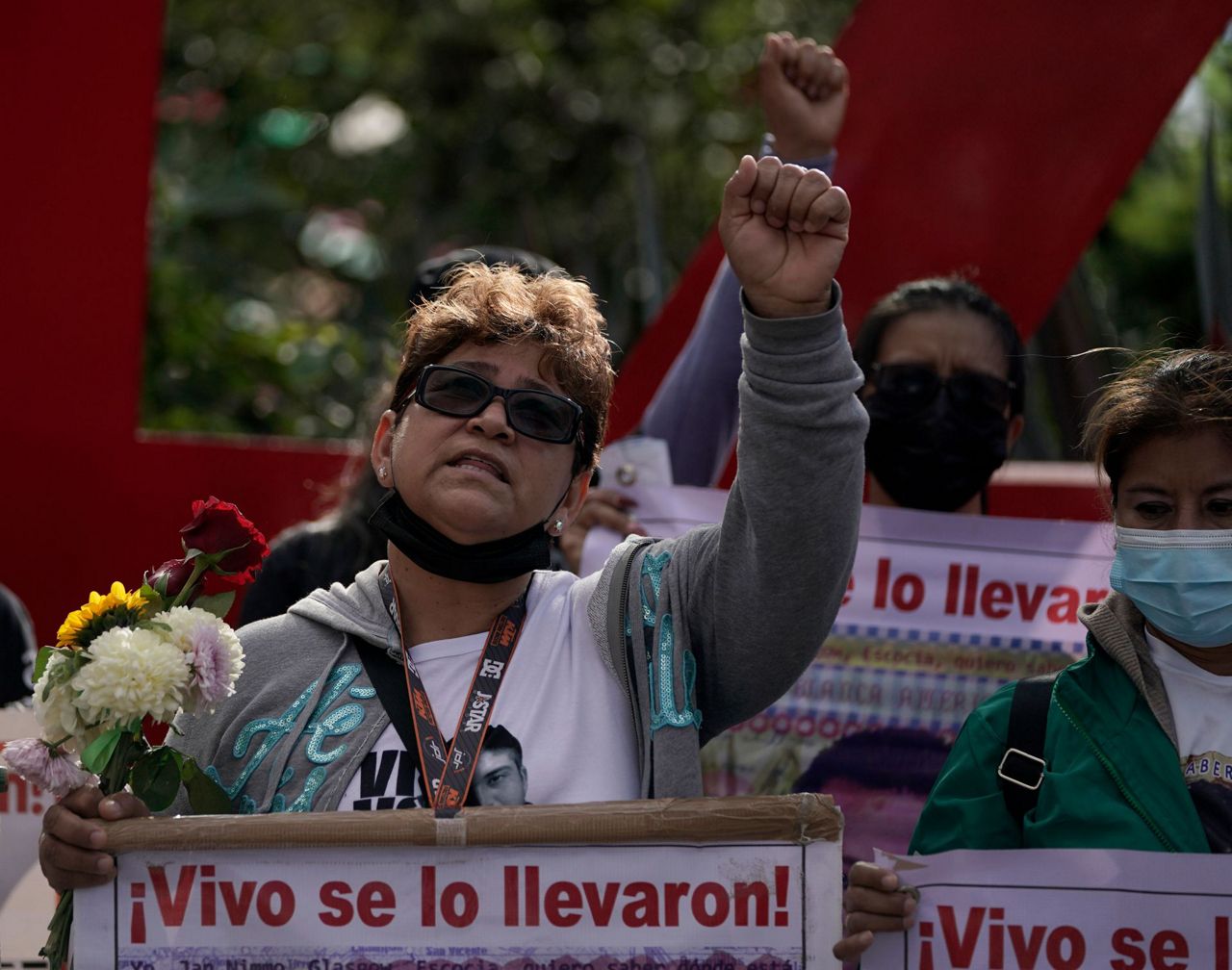 Families of Mexico's missing students march on anniversary