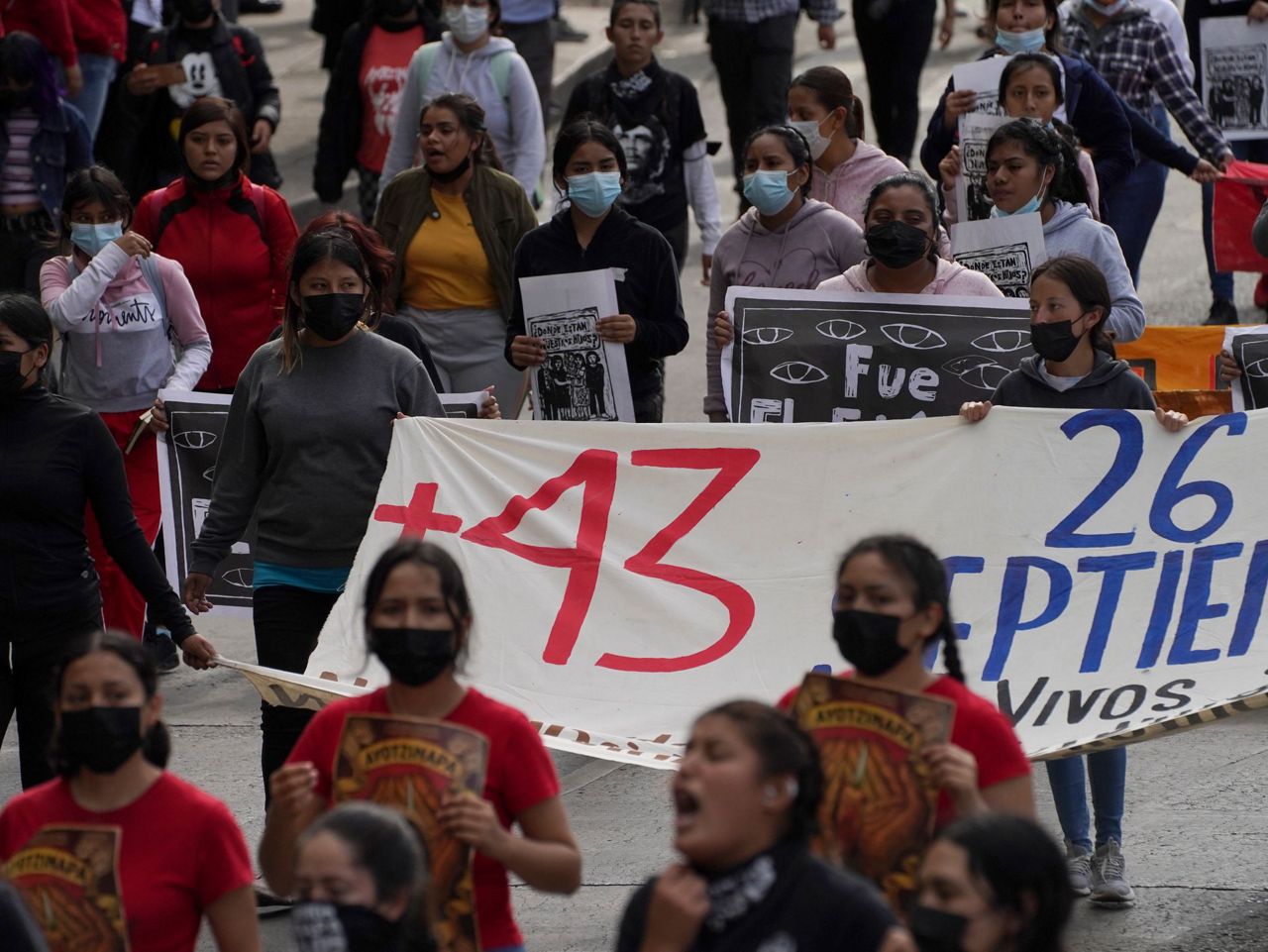 Families of Mexico's missing students march on anniversary