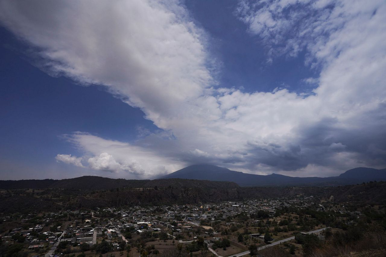 Mexico's Popocatepetl volcano spewing ash and gas closes schools