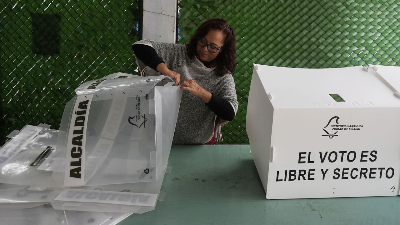 An electoral worker prepares ballot boxes for the country's first judicial elections in Mexico City, June 1, 2025. (AP Photo/Fernando Llano)
