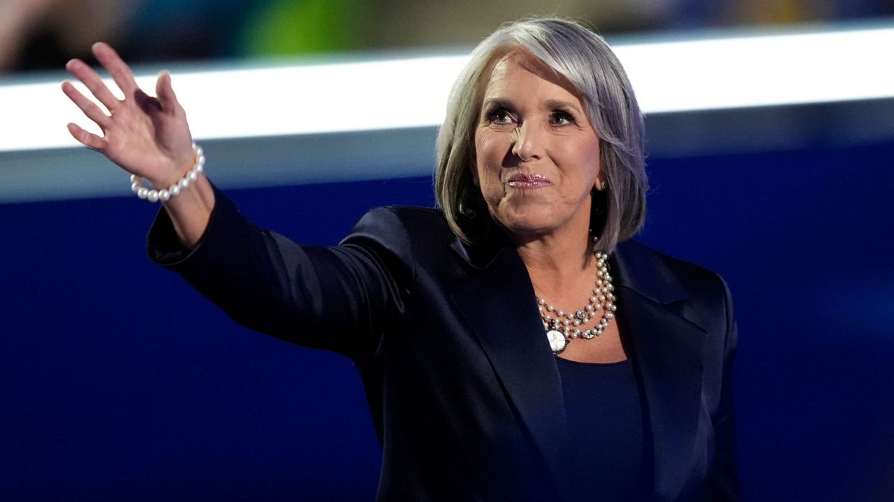 New Mexico Gov. Michelle Lujan Grisham waves during the Democratic National Convention Tuesday, Aug. 20, 2024, in Chicago. (AP Photo/Charles Rex Arbogast)