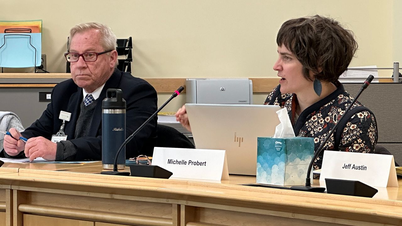 Mark Souders of MaineGeneral Medical Center and Michelle Probert, director of the Office MaineCare Services, discuss health care facility fees Thursday during a task force meeting in Augusta. (Spectrum News/Susan Cover)