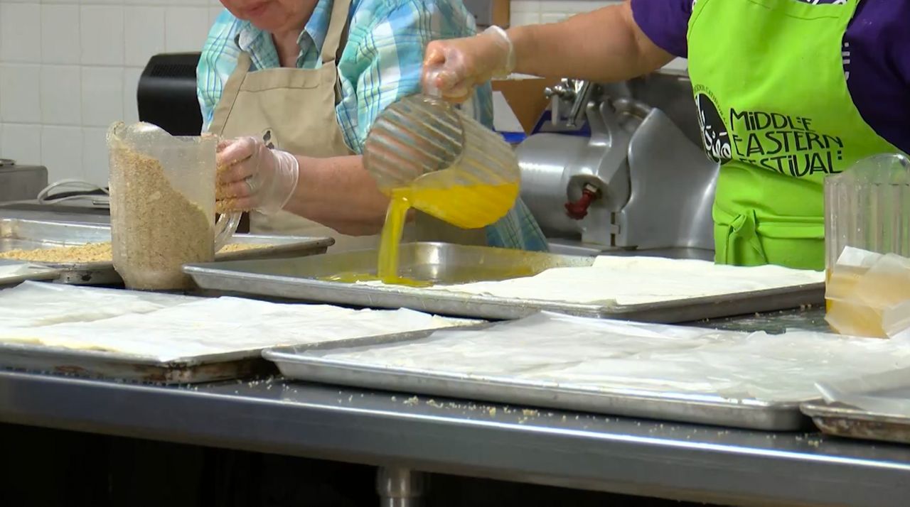 Volunteers prepare to welcome thousands of people to this year’s Middle Eastern Festival in Worcester. (Spectrum News 1/Meghan Parsons)