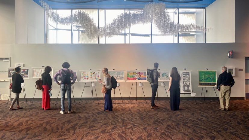 The third floor of the convention center served as an important gathering spot before, during and after panel discussions. (Spectrum News 1/Casey Weldon)