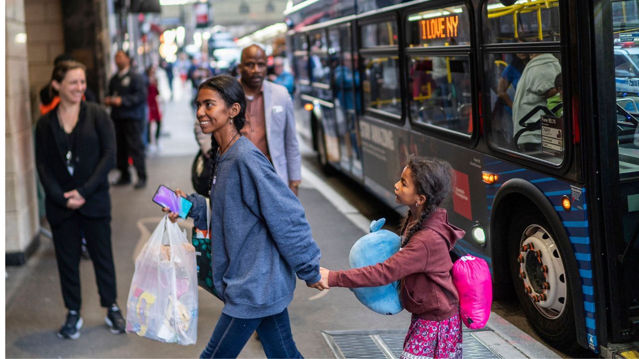 Asylum seekers arrive at the Roosevelt Hotel on Friday, May 19, 2023, in New York. (AP Photo/Eduardo Munoz Alvarez, File)