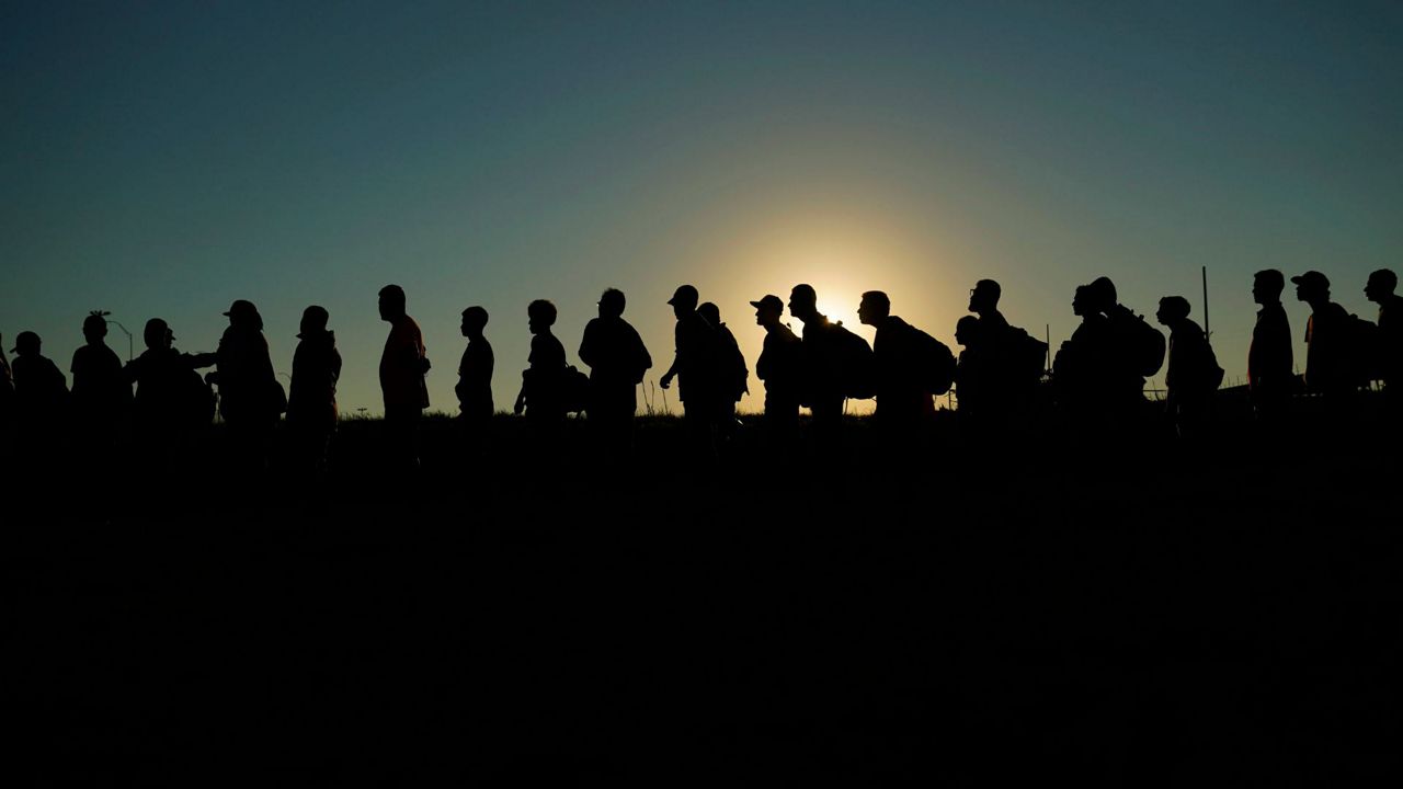 Migrants who crossed the Rio Grande and entered the U.S. from Mexico are lined up for processing by U.S. Customs and Border Protection, Sept. 23, 2023, in Eagle Pass, Texas. (AP Photo/Eric Gay, File)