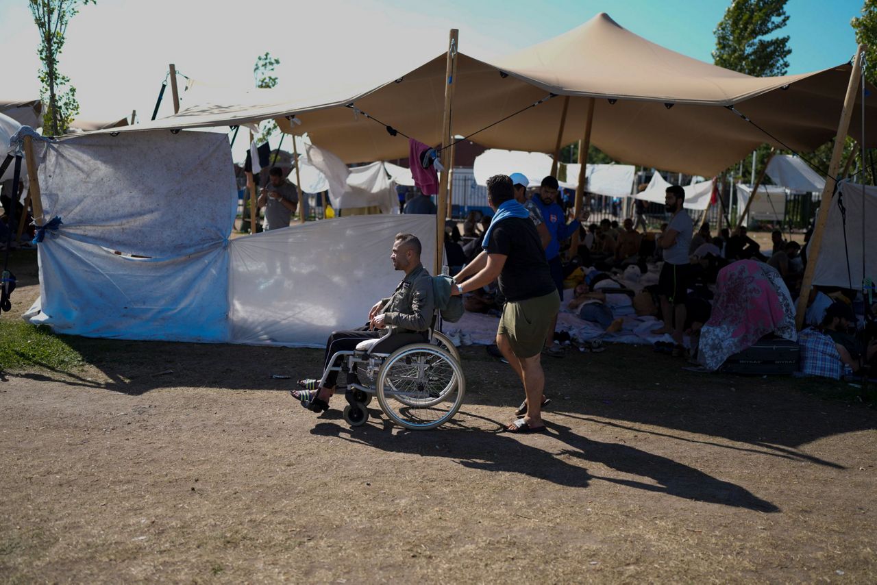 Dutch Agencies Help Migrants Sleeping Outside Crowded Camp