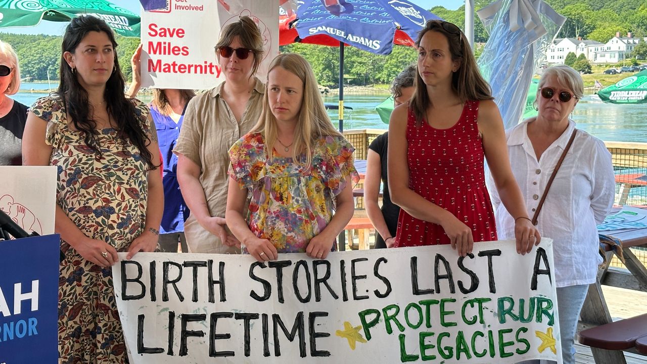 Parents gathered in Damariscotta Friday to speak out against the potential closure of the birthing unit at MaineHealth Lincoln Hospital. (Spectrum News/Susan Cover)