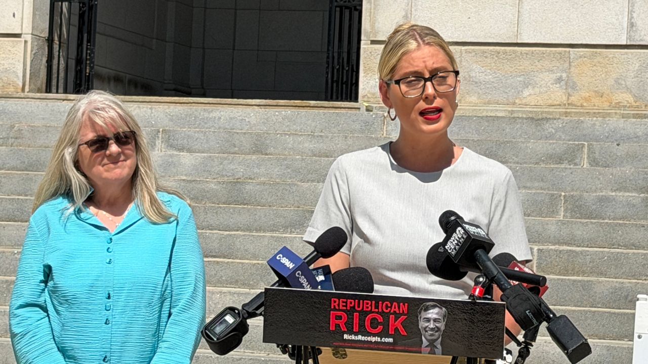 Former state Rep. Rebecca Millett (D-Cape Elizabeth), left, and Devon Murphy-Anderson, executive director of the Maine Democratic Party, talk about those who are supporting Sen. Rick Bennett’s run for governor in Portland on Thursday. (Spectrum News/Susan Cover)