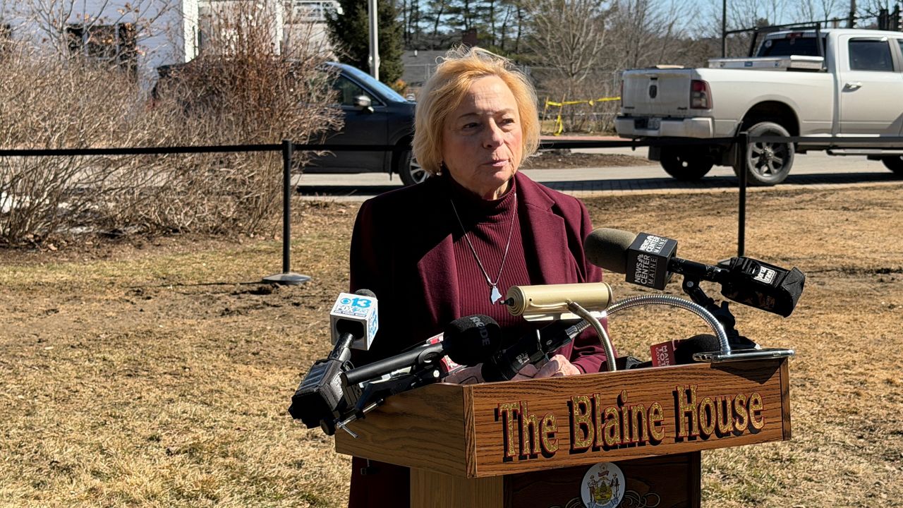 Gov. Janet Mills takes questions from reporters on the Blaine House lawn on Tuesday. (Spectrum News/Susan Cover)