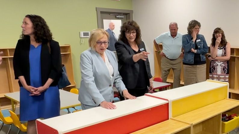 Rep. Anne-Marie Mastraccio (D-Sanford), center, gesturing, talks with Gov. Janet Mills during a tour of a new expanded child care center at the Sanford-Springvale YMCA Tuesday. (Spectrum News/Sean Murphy)