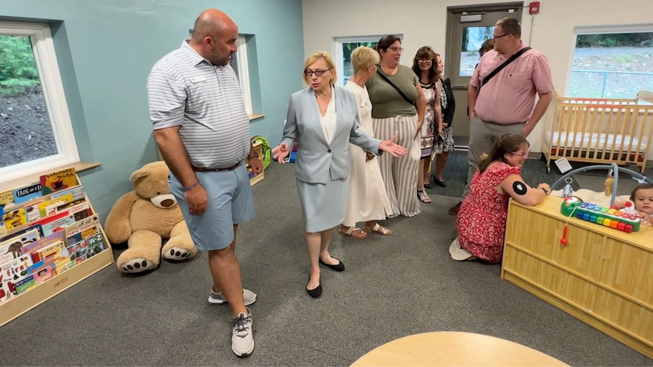 Gov. Janet Mills, center, meets with staff at the Sanford-Springvale YMCA's new expanded child care center Tuesday. The Mills administration provided a $250,000 grant to pay for an expansion for the center. (Spectrum News/Sean Murphy)