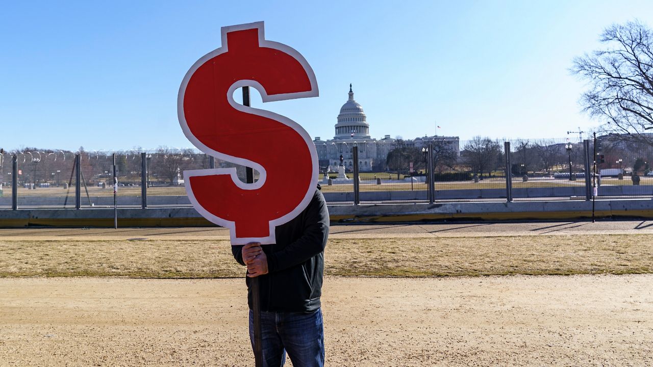 Activists appeal for a $15 minimum wage near the Capitol in Washington, Thursday, Feb. 25, 2021. (J. Scott Applewhite/AP)