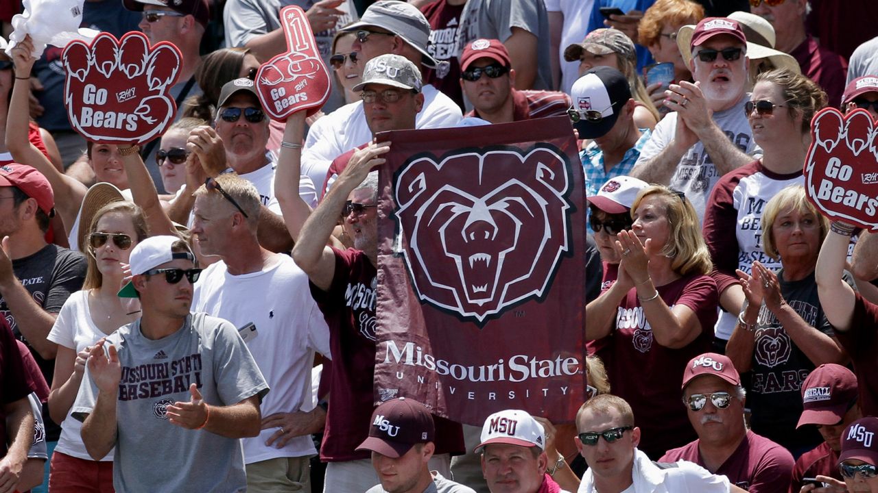 Fans hold Missouri State flags during a tournament in Fayetteville, Ark., Sunday, June 7, 2015. Missouri State is moving up to the highest tier of Division I college football and joining Conference USA in 2025. (AP Photo/Danny Johnston, File)