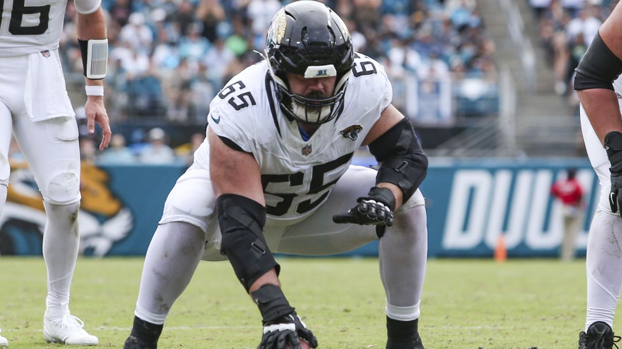 Jacksonville Jaguars center Mitch Morse (65) sets to snap the ball during an NFL football game against the Cleveland Browns in Jacksonville, Fla., Sept. 15, 2024. The Browns defeated the Jaguars 18-13. (AP Photo/Gary McCullough, File)