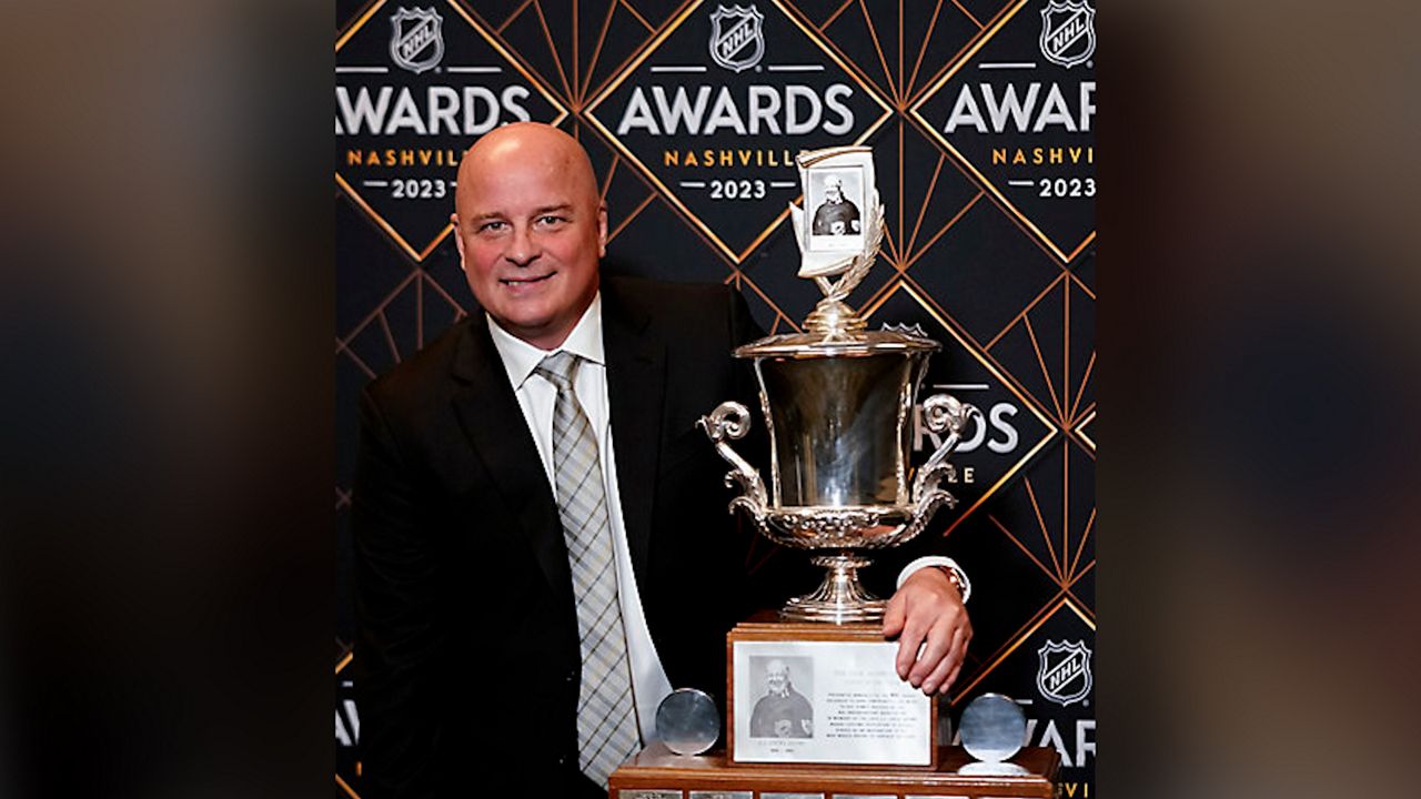 Boston Bruins hockey head coach Jim Montgomery poses after winning the Jack Adams Award at the NHL Awards, Monday, June 26, 2023, in Nashville, Tenn. (AP Photo/George Walker IV)