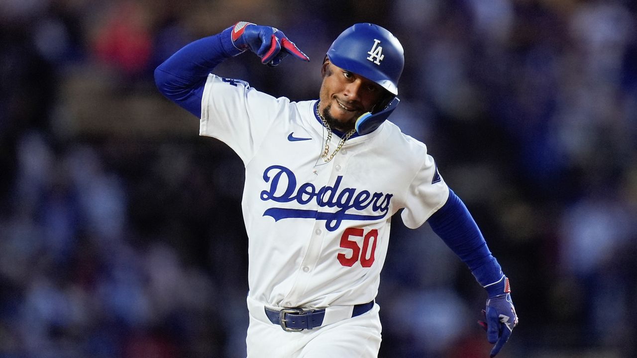 Los Angeles Dodgers' Mookie Betts celebrates his home run during the first inning of a baseball game against the St. Louis Cardinals Friday, March 29, 2024, in Los Angeles. (AP Photo/Jae C. Hong)