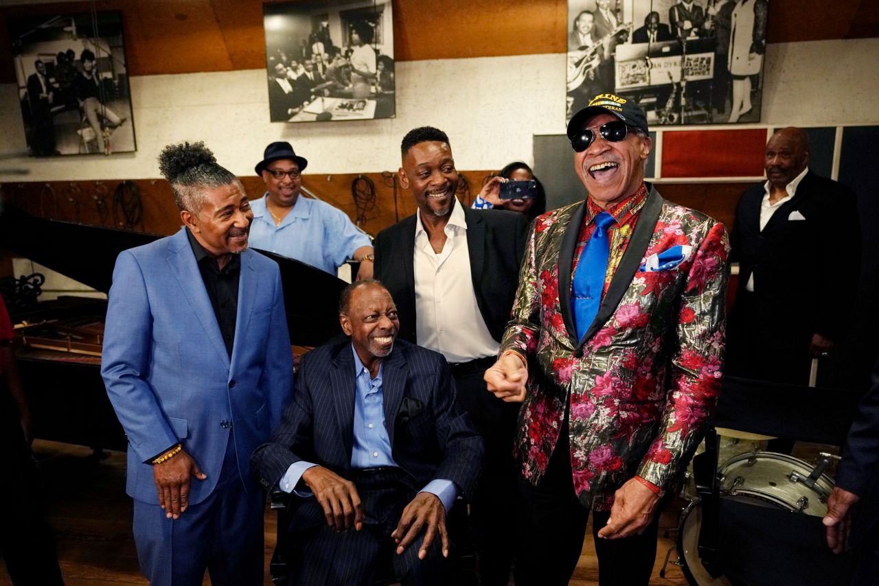 Famed R&B group The Spinners donate performance outfits to Motown