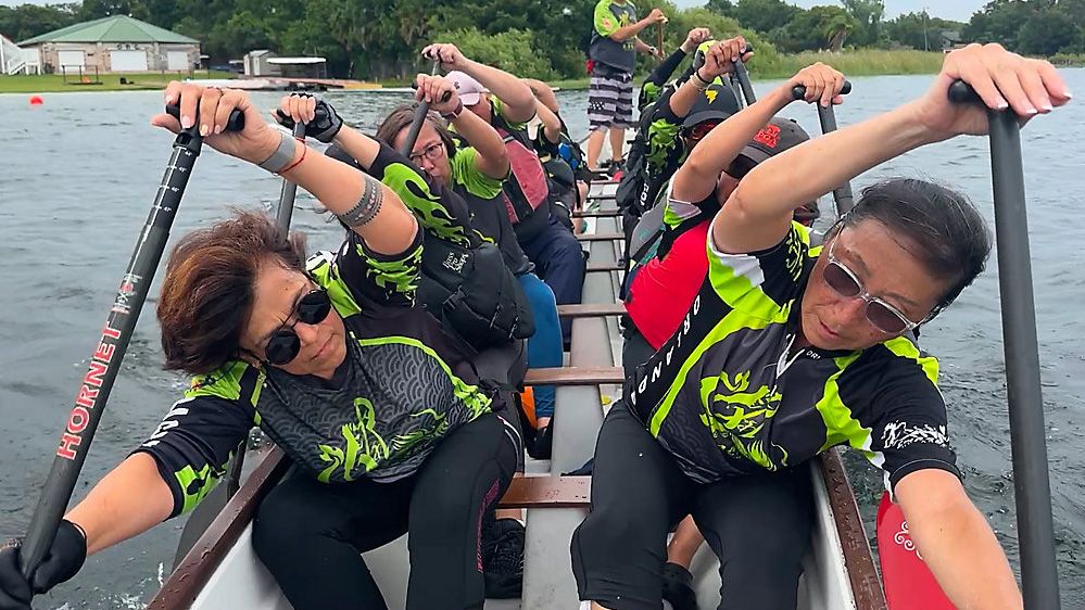 The C.H.A.R.G.E. Dragon Boat team practicing at their home lake in Orlando. (Spectrum Sports 360)