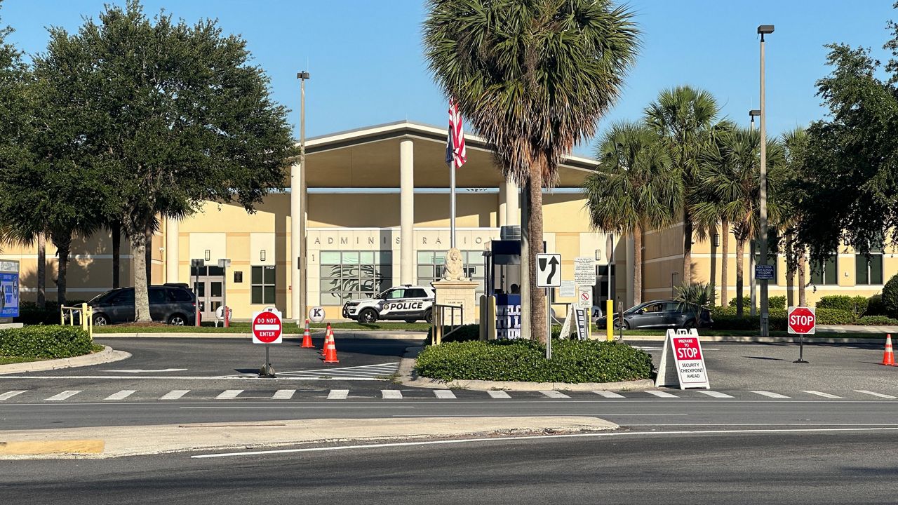 Body of Lake Nona High School student pulled from Lake Whippoorwill on Thursday after going paddle boarding and kayaking with friends Wednesday afternoon. (Spectrum News/Massiel Leyva)