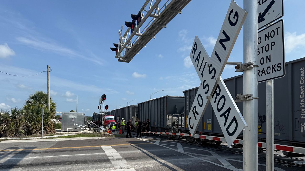 Police: Train hits semi-truck stuck on tracks in Melbourne