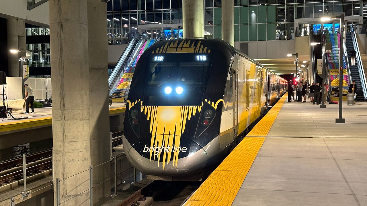 A Brightline train exiting the Orlando International Airport train terminal and headed South to Miami. Discussions are now taking place to set aside a rail corridor along I-4 for the Tampa to Orlando route. (Spectrum News/Massiel Leyva)