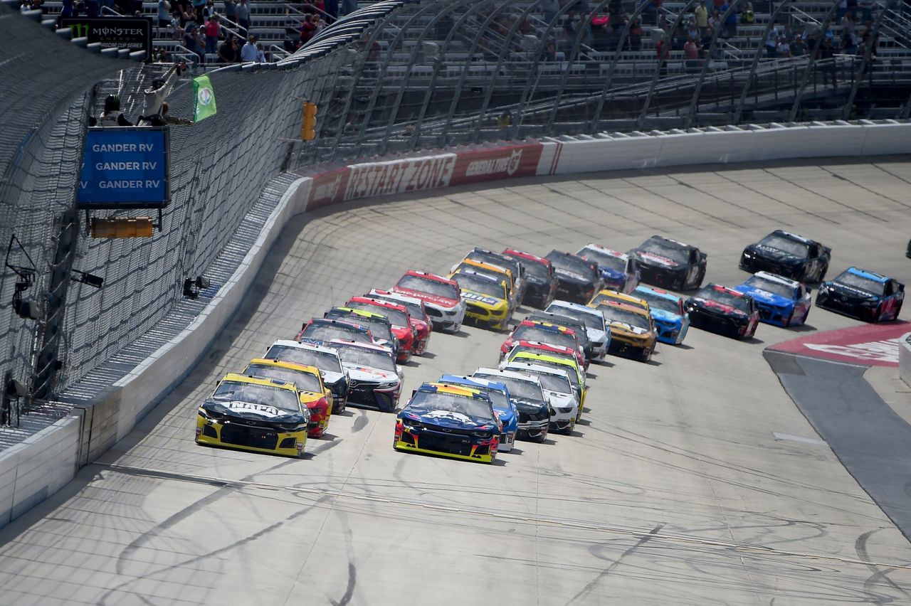 The Latest Logano wins 1st stage at Dover