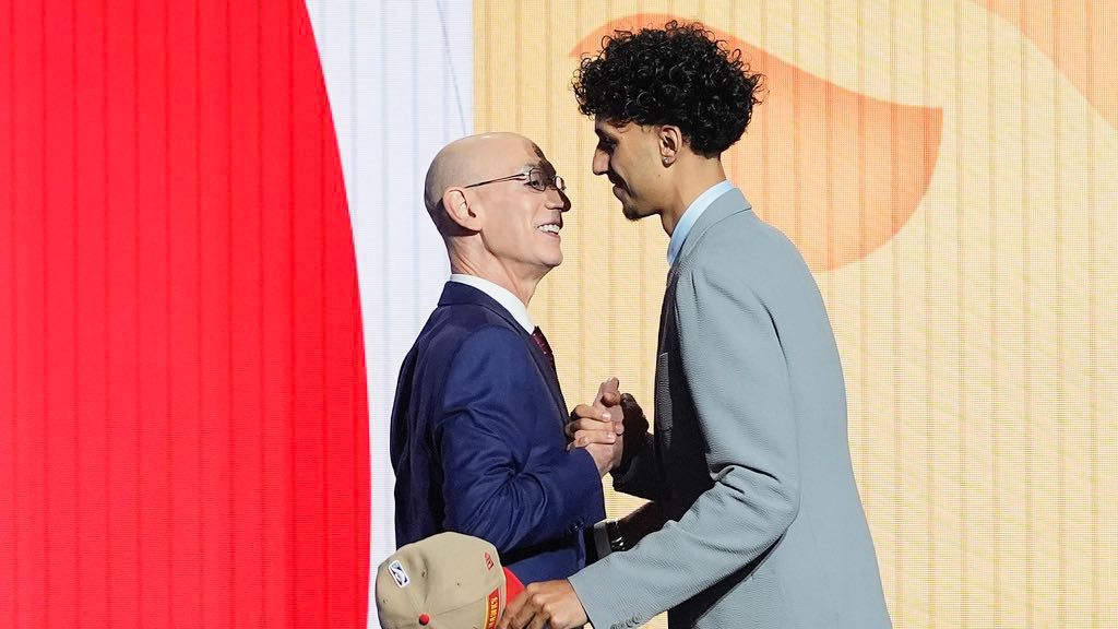 Zaccharie Risacher, right, greets NBA commissioner Adam Silver after being selected as the first overall pick by the Atlanta Hawks in the first round of the NBA basketball draft, Wednesday, June 26, 2024, in New York. (AP Photo/Julia Nikhinson)