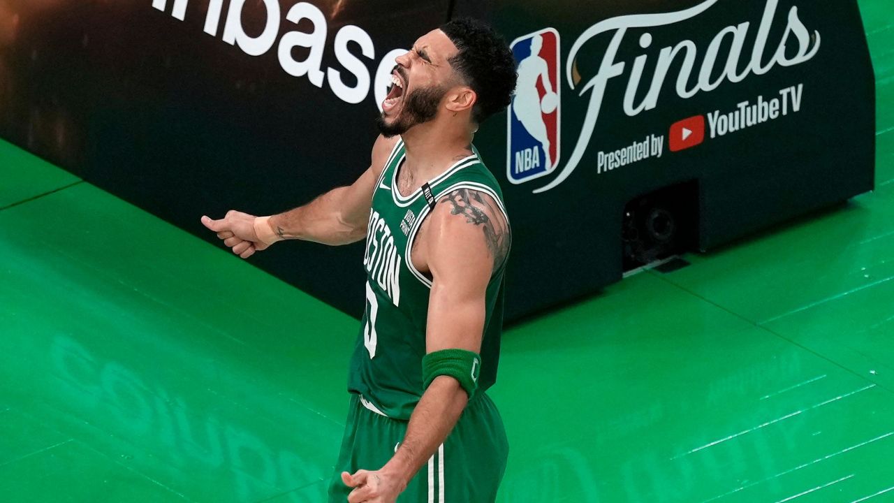 Boston Celtics' Jayson Tatum celebrates after scoring during the first half of Game 5 of the NBA basketball finals against the Dallas Mavericks, Monday, June 17, 2024, in Boston. (AP Photo/Michael Dwyer)