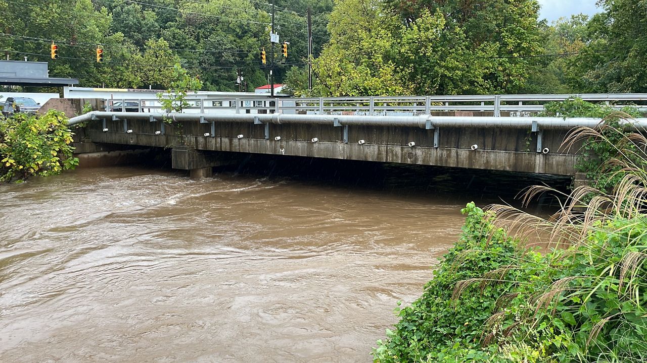 The Swannanoa River in Asheville was already over its banks Thursday morning with lots more rain expected to come from Helene. (Spectrum News 1/Jordan Kudisch)