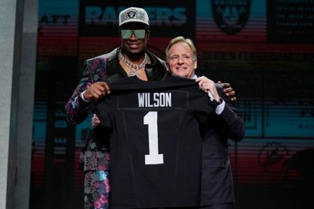 Georgia defensive tackle Jordan Davis holds a jersey after being chosen by  the Philadelphia Eagles with the 13th pick of the NFL football draft  Thursday, April 28, 2022, in Las Vegas. (AP