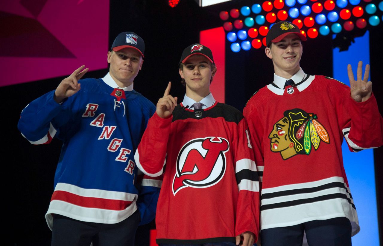 Devils select US center Hughes with 1st pick in NHL draft