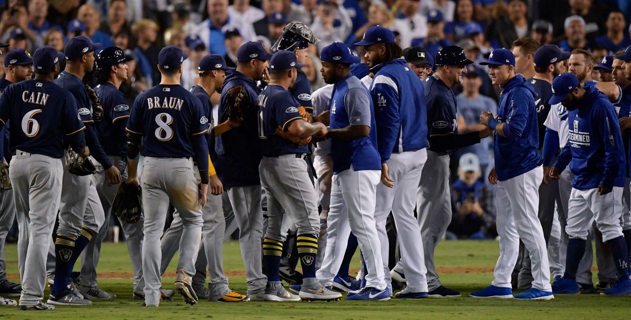 Benches clear after Machado clips Aguilar's leg in NLCS