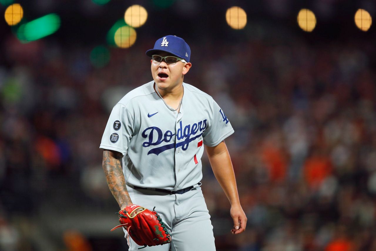 Urías hits, pitches Dodgers past Giants to even NLDS series
