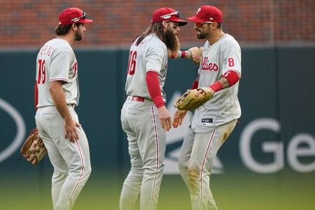 Cardinals score 4 in 9th, hold off Braves 7-6 in NLDS opener