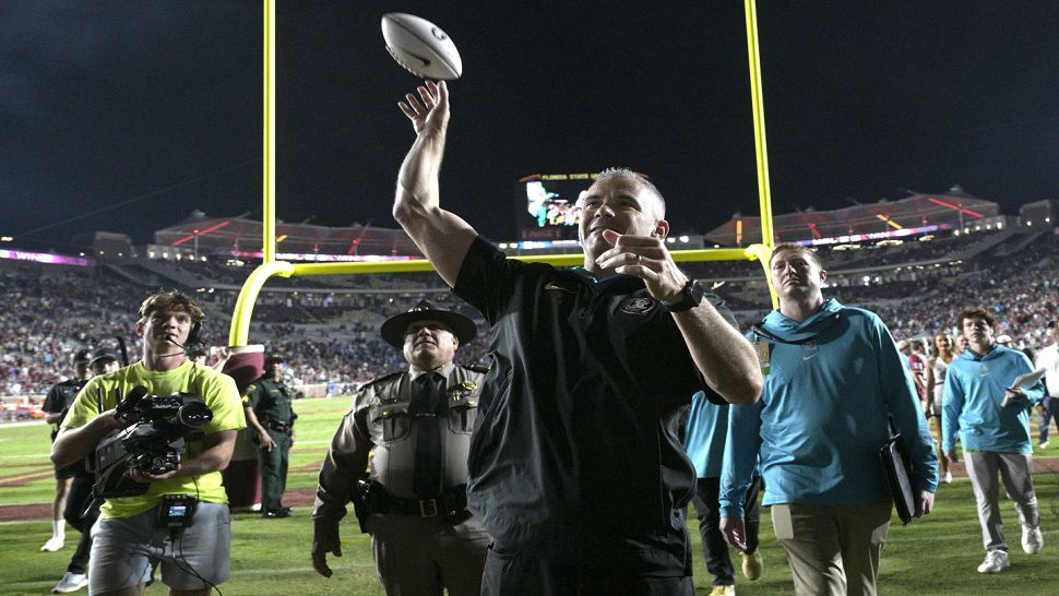 Florida State head coach Mike Norvell throws a ball into the stands after the team won an NCAA college football game against Duke, Saturday, Oct. 21, 2023, in Tallahassee, Fla. (AP Photo/Phelan M. Ebenhack)