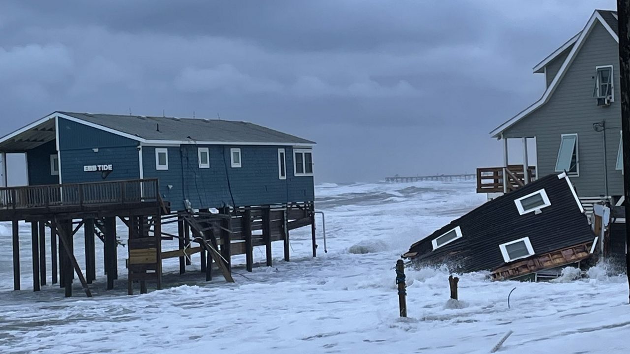 Portion of collapsed house in the water at Surf Side Drive in Rodanthe. (National Park Service) 