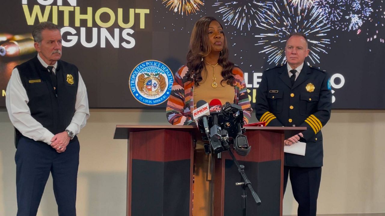 St. Louis Mayor Tishaura Jones (center) answers questions at a Monday news conference at SLMPD headquarters alongside police chief Robert Tracy (right) and Dennis Jenkerson (left). 