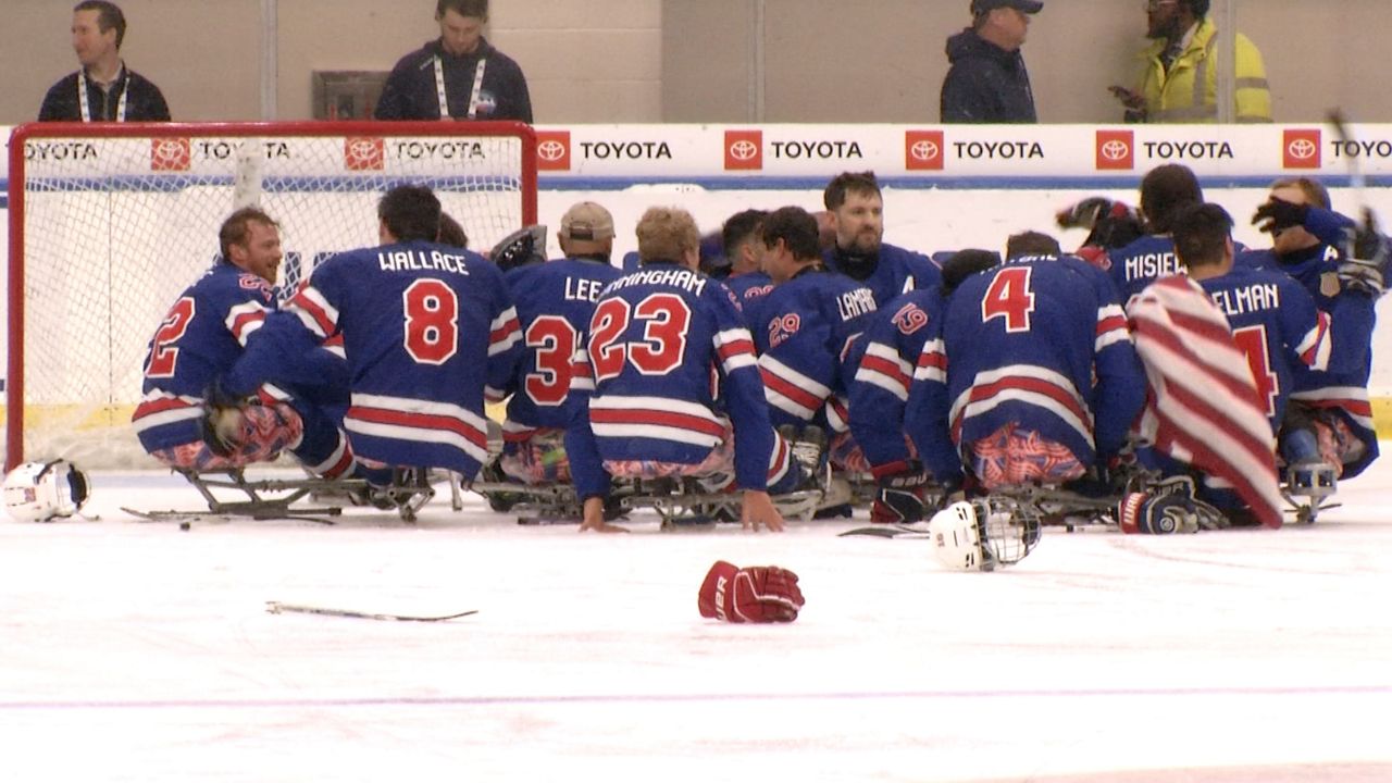 The USA sled hockey team celebrates after winning a World Championship on home ice, 6-1 over Canada